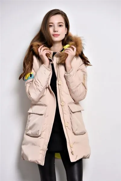 Long padded winter coat for women with fur hood and color contrast